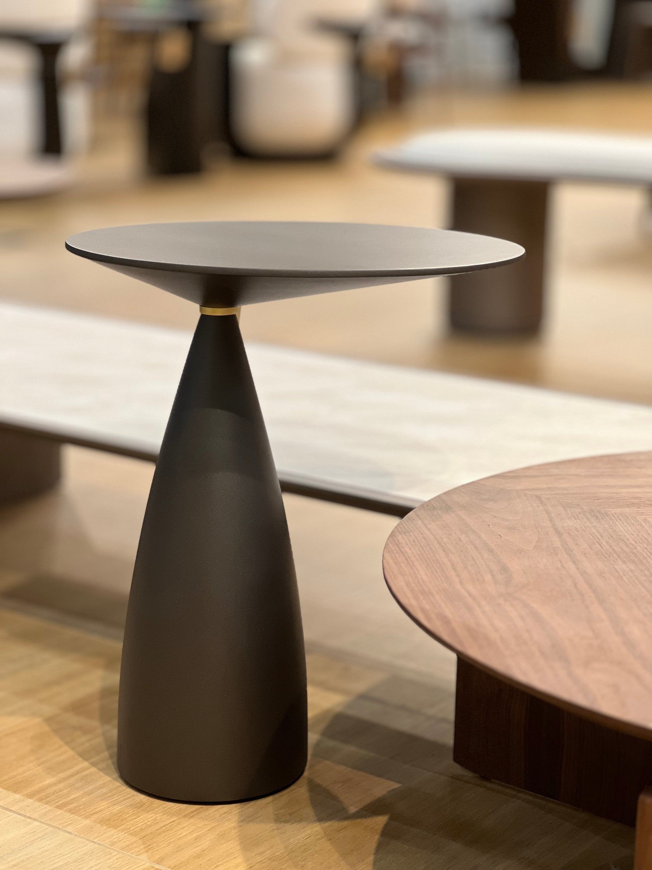 Modern black side table with a blurred background