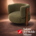 Load image into Gallery viewer, Green armchair with wooden legs on a brown background, featuring Salone del Mobile Milano logo.
