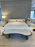 Load image into Gallery viewer, Modern bedroom with a bed, nightstands, and a bench.