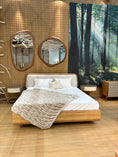 Load image into Gallery viewer, Wooden bed with white bedding in a room with mirrors and a forest mural.