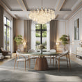 Load image into Gallery viewer, Modern dining room with a chandelier, marble round dining table, and chairs.