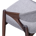 Load image into Gallery viewer, Gray upholstered chair with wooden legs on a white background