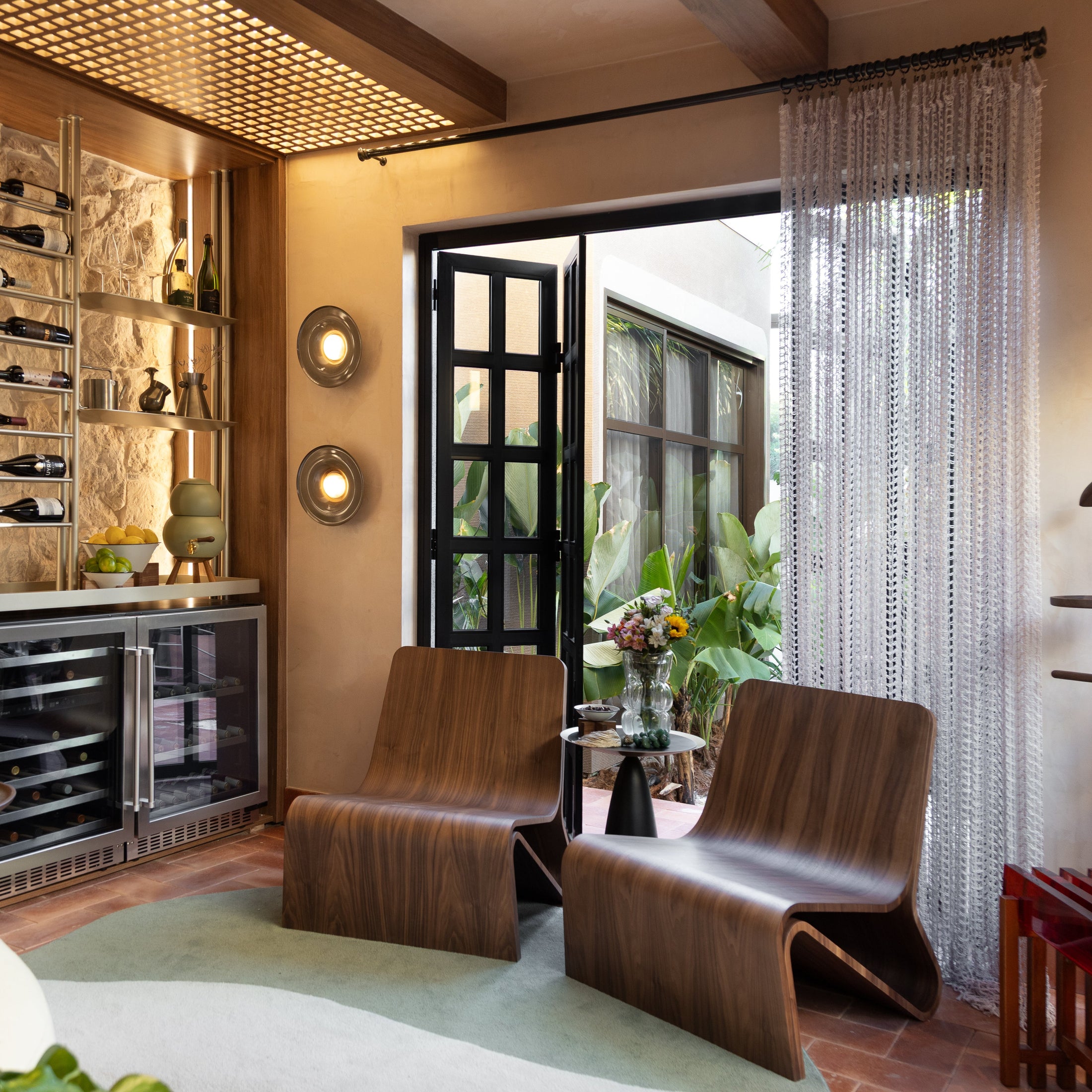 Modern interior with wooden chairs, a rug, and decorative elements.