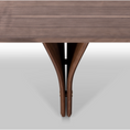 Load image into Gallery viewer, A rectangular dining table leg detail showing natural walnut wood finish and a distinctive Y-shaped design in its legs, set against a white background.