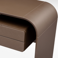Load image into Gallery viewer, A minimalist brown desk with a modern design, featuring a unique curved shape and a small drawer.