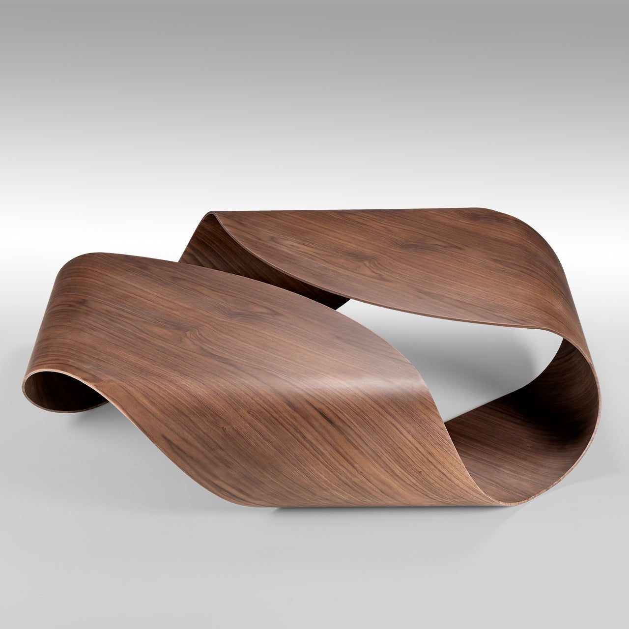 sculptural coffee table in walnut finish, organic shape