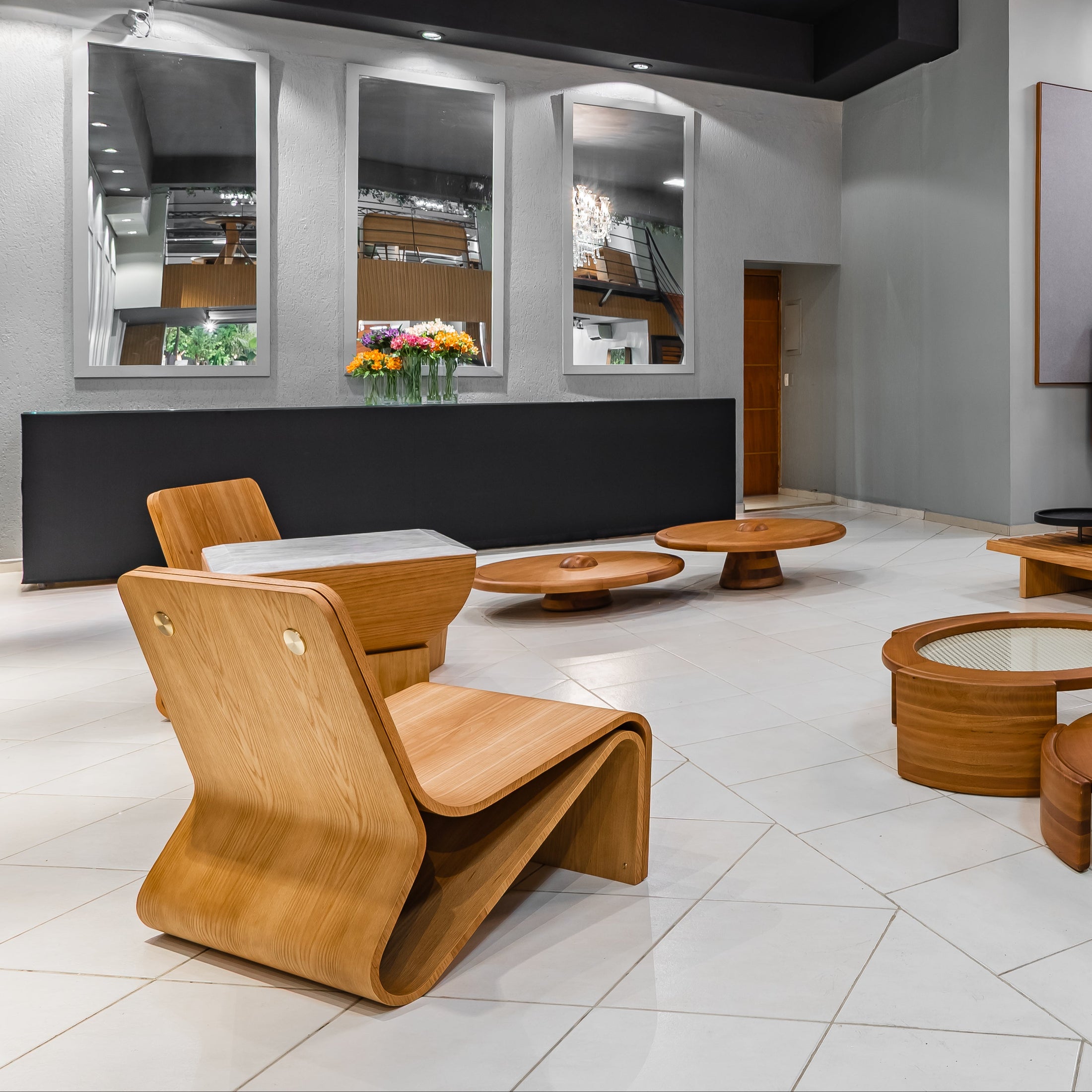 Modern interior design with wooden furniture and a chandelier.
