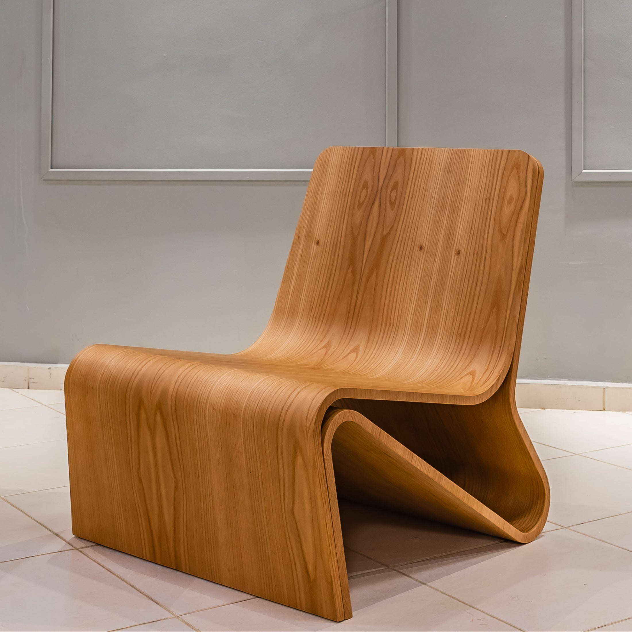 Wooden chair with a modern design in a minimalistic room.