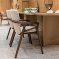 Load image into Gallery viewer, Dining area with wooden table and chairs in a modern interior setting.