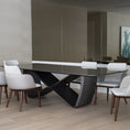 Load image into Gallery viewer, A modern dining table with a unique infinity symbol shaped base and a lacquer tabletop.