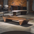 Load image into Gallery viewer, Modern wooden coffee table in a room with concrete floor and brick wall.