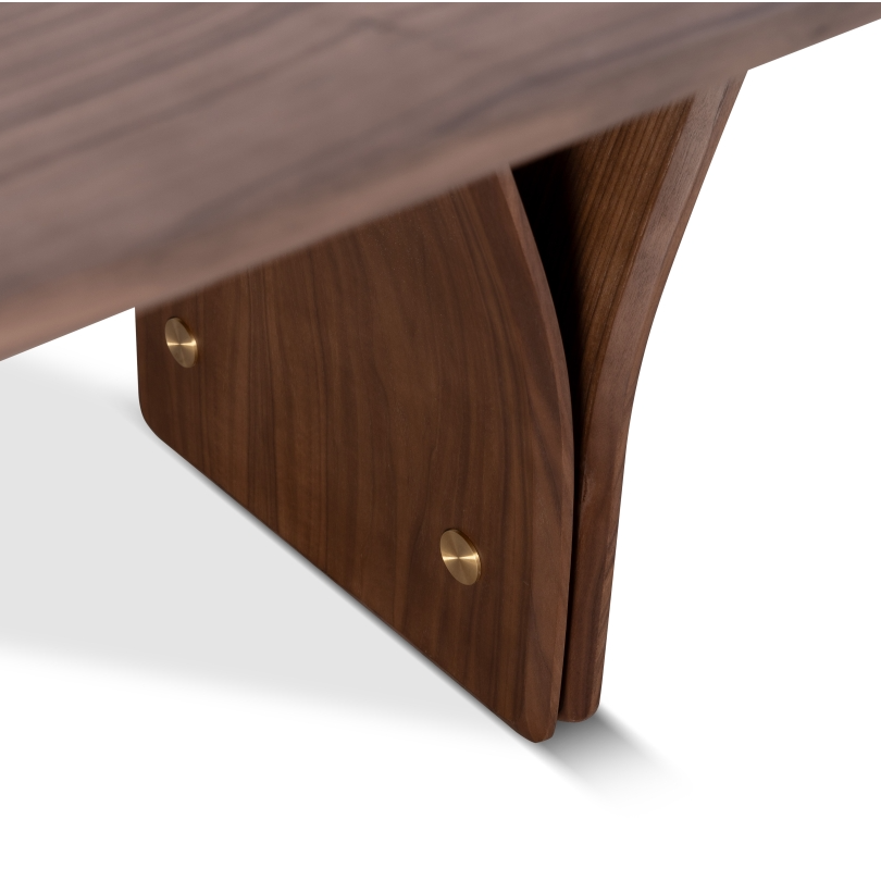 A rectangular dining table with a dark wood finish and a distinctive Y-shaped design in its legs, set against a white background.