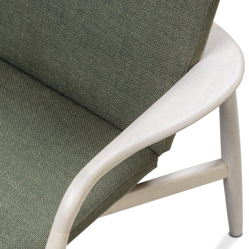 Green upholstered chair with white wood frame on a white background