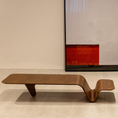 Load image into Gallery viewer, Modern wooden coffee table in a minimalistic room with a large mirror on the wall.