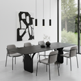 Load image into Gallery viewer, Modern dining room with a black dining table and gray chairs, featuring abstract art on the wall.
