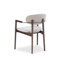 Load image into Gallery viewer, A modern armchair with a dark brown wooden frame, a curved glass backrest, and light beige textured upholstery on the seat and backrest, shown against a plain white background.