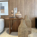 Load image into Gallery viewer, Wicker vases on a tiled floor with a wooden wall and side table in the background