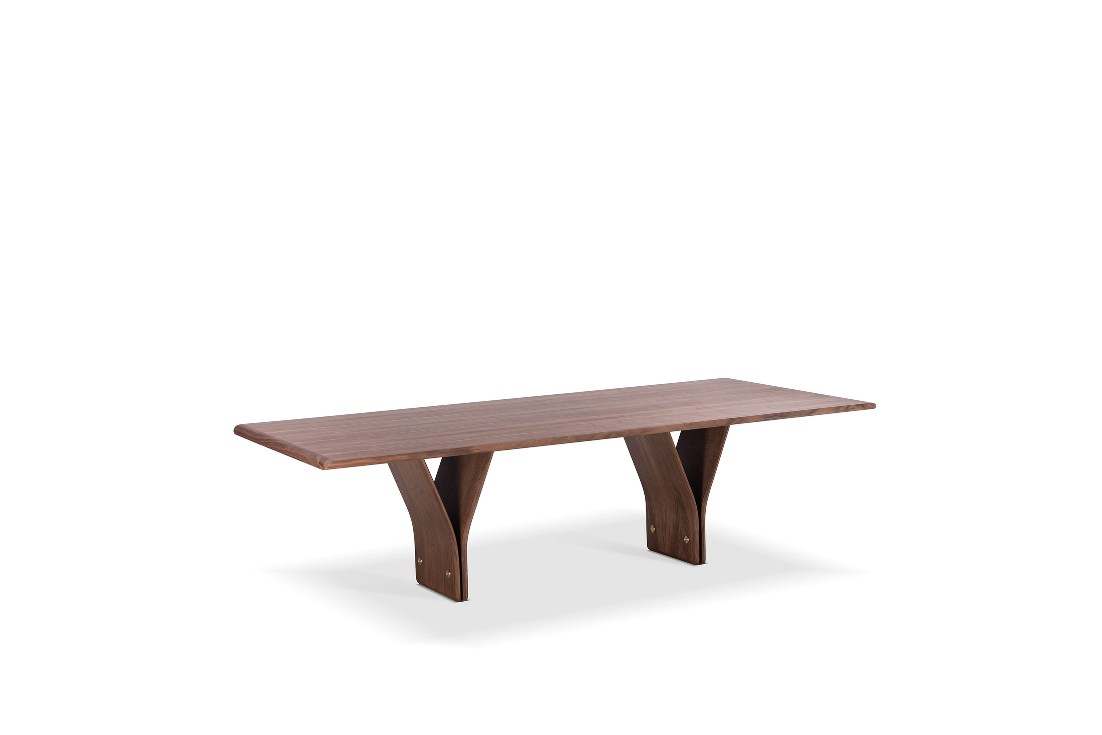 A rectangular dining table with natural walnut wood finish and a distinctive Y-shaped design in its legs, set against a white background.