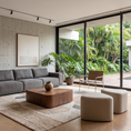 Load image into Gallery viewer, Modern living room with gray sofa, wooden coffee table, and large windows overlooking a garden.