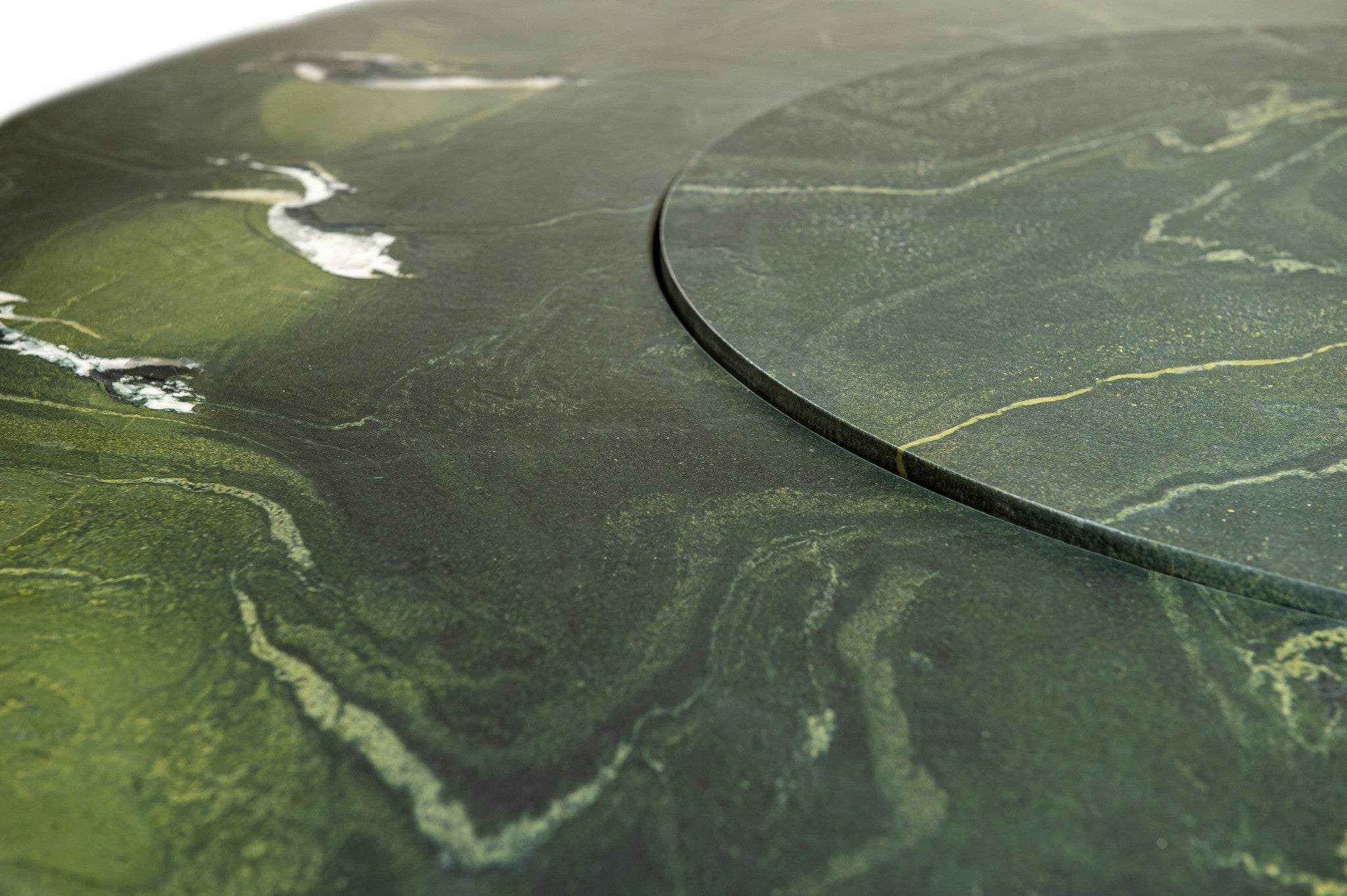 Close-up of a green stone surface with natural patterns