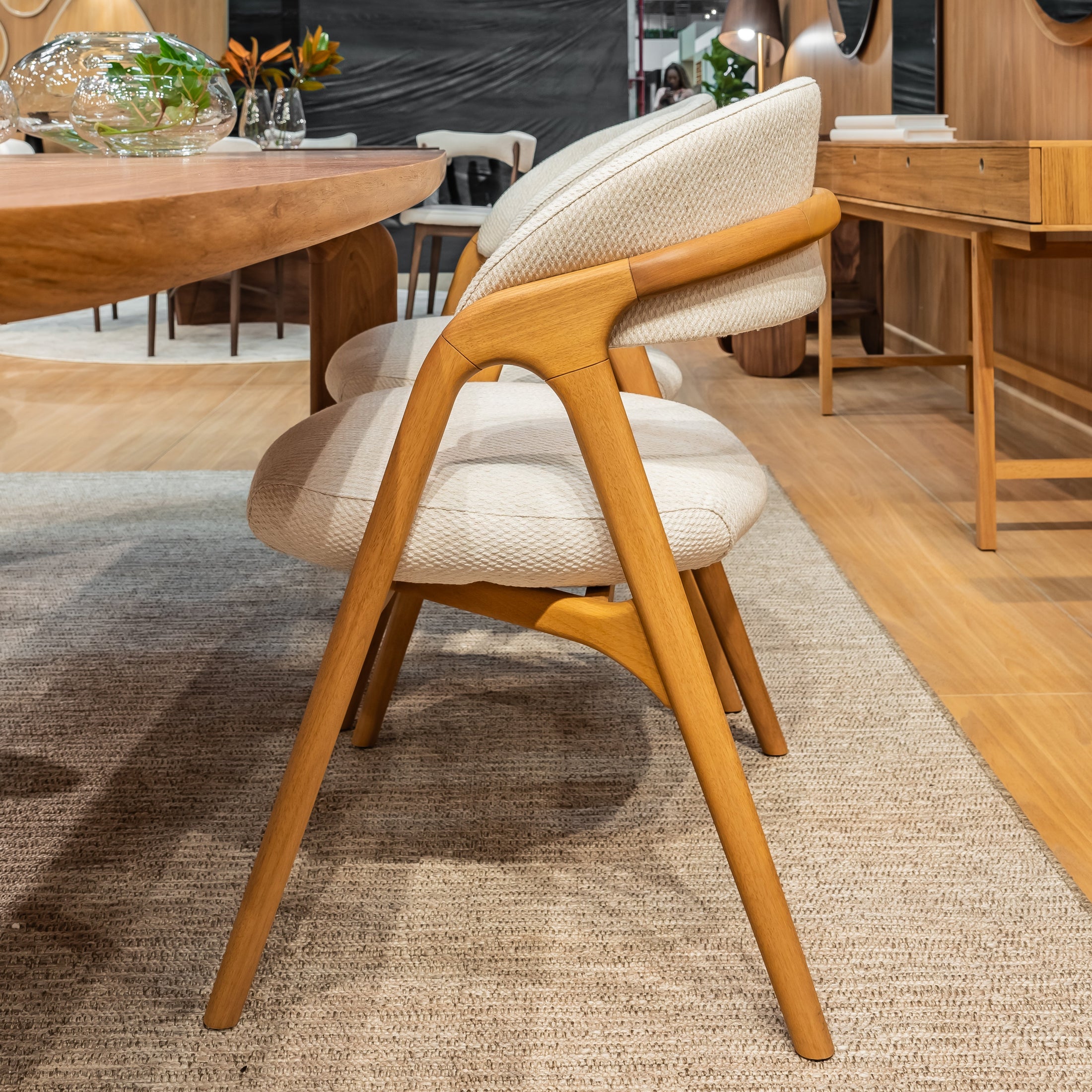 Wooden chair with beige cushion in a modern indoor setting