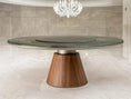 Load image into Gallery viewer, Round dining table with a wooden base and green marble top in a modern interior setting.
