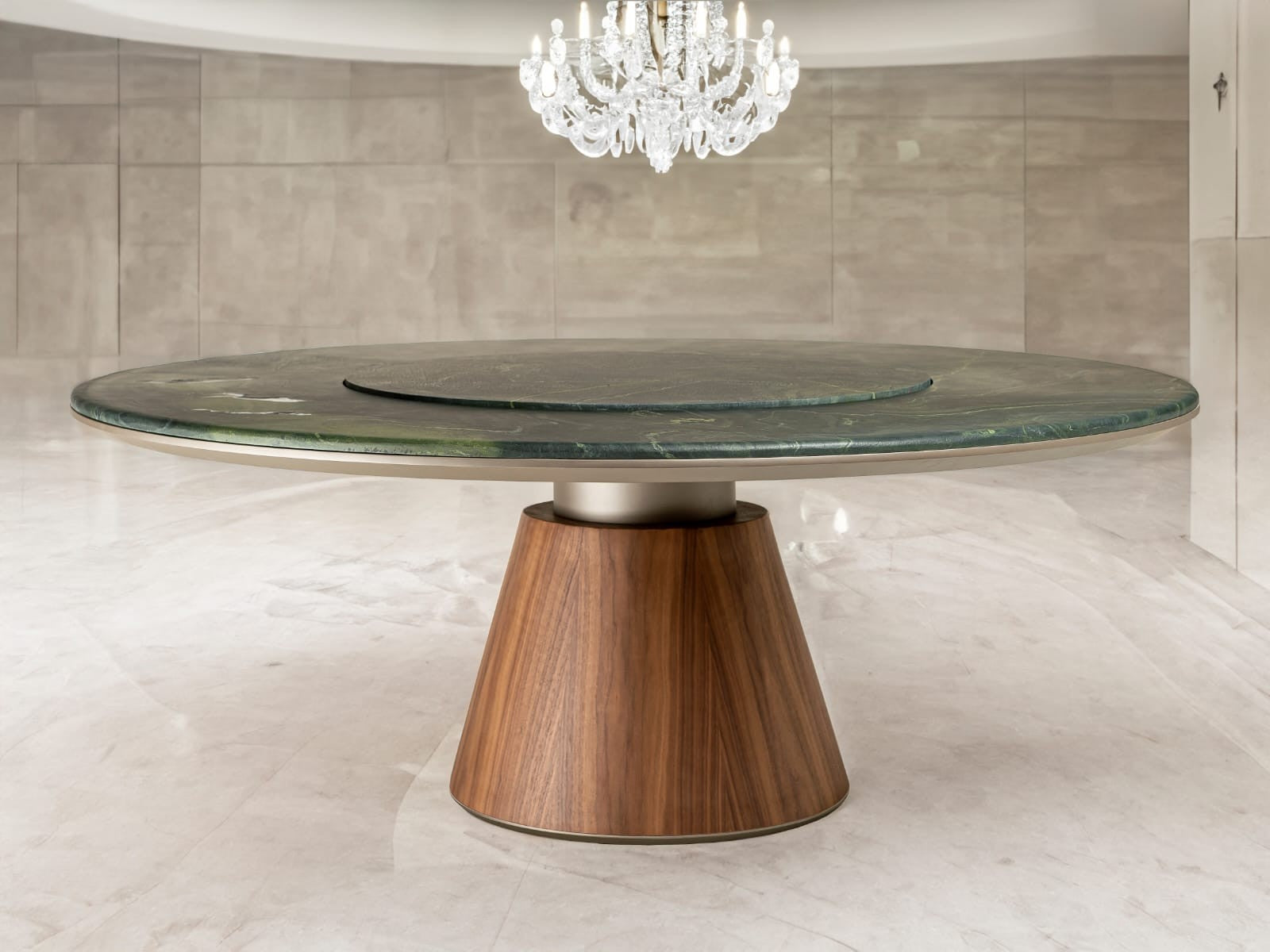 Round dining table with a wooden base and green marble top in a modern interior setting.