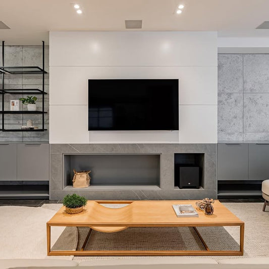 A modern coffee table with a minimalist metal base and a wooden surface featuring a unique curved detail.
