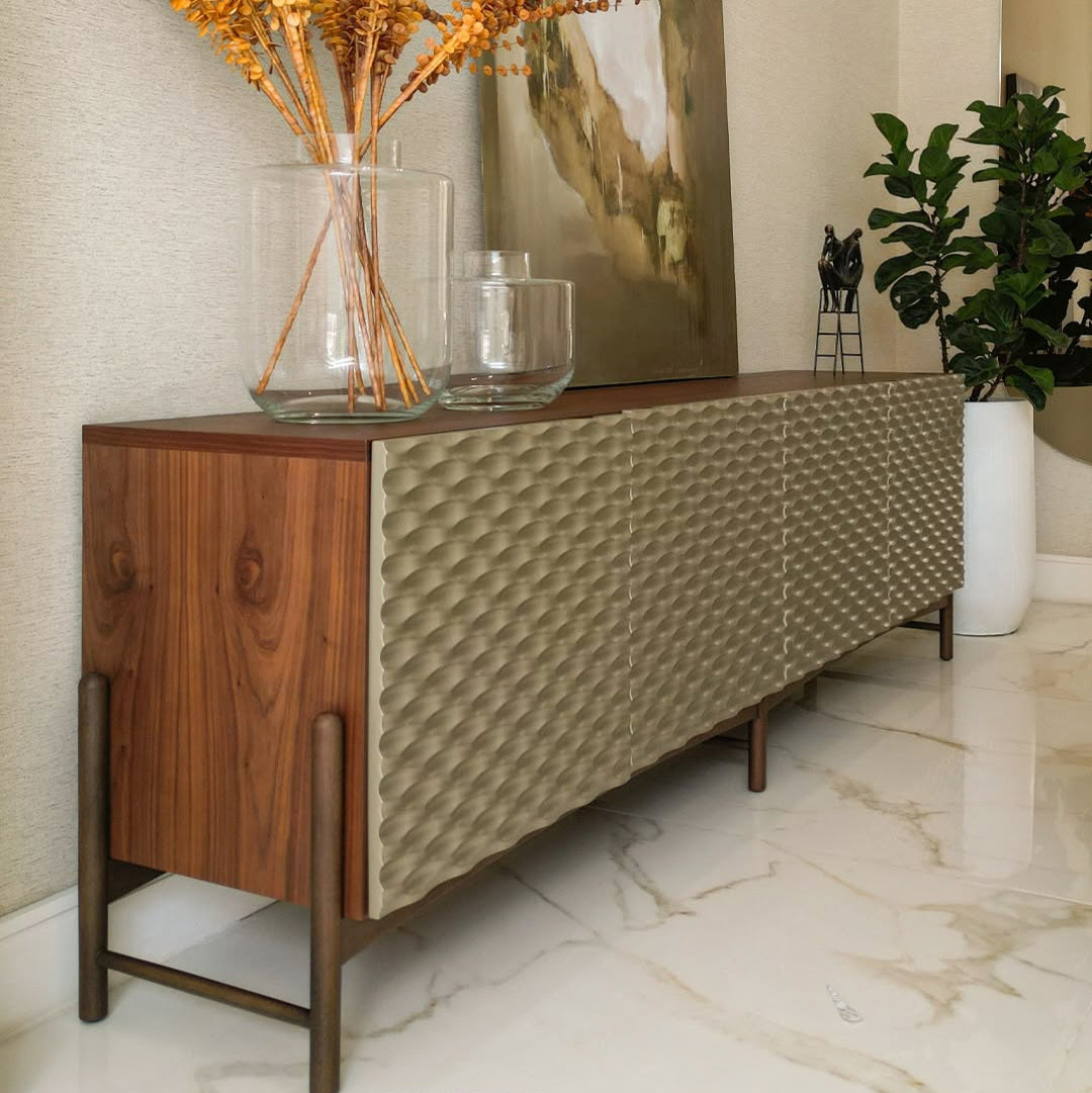 A sideboard with a smooth, lacquered finish and wood finish  with four doors