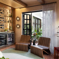 Load image into Gallery viewer, Modern interior with wooden chairs, a rug, and decorative elements.

