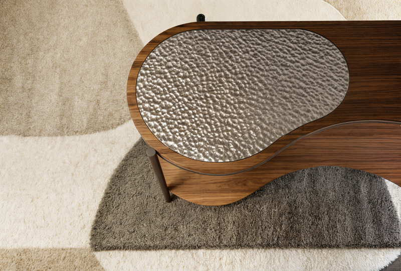 Close-up of Fazani walnut furniture with a hammered metal top