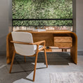Load image into Gallery viewer, Wooden desk with white chair in a room with a green wall
