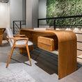 Load image into Gallery viewer, Modern office interior with a wooden desk and chair, and a green wall feature.
