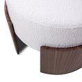 Load image into Gallery viewer, Close-up of a round ottoman with wooden legs on a white background
