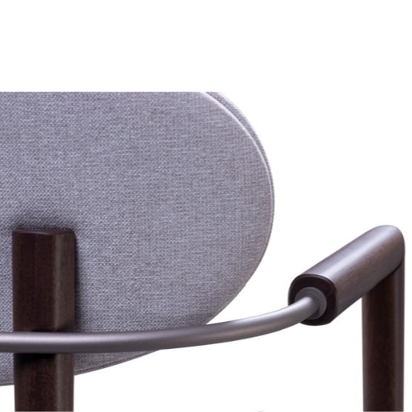Close-up of a stool with a gray cushioned backrest and metal armrest on a white background