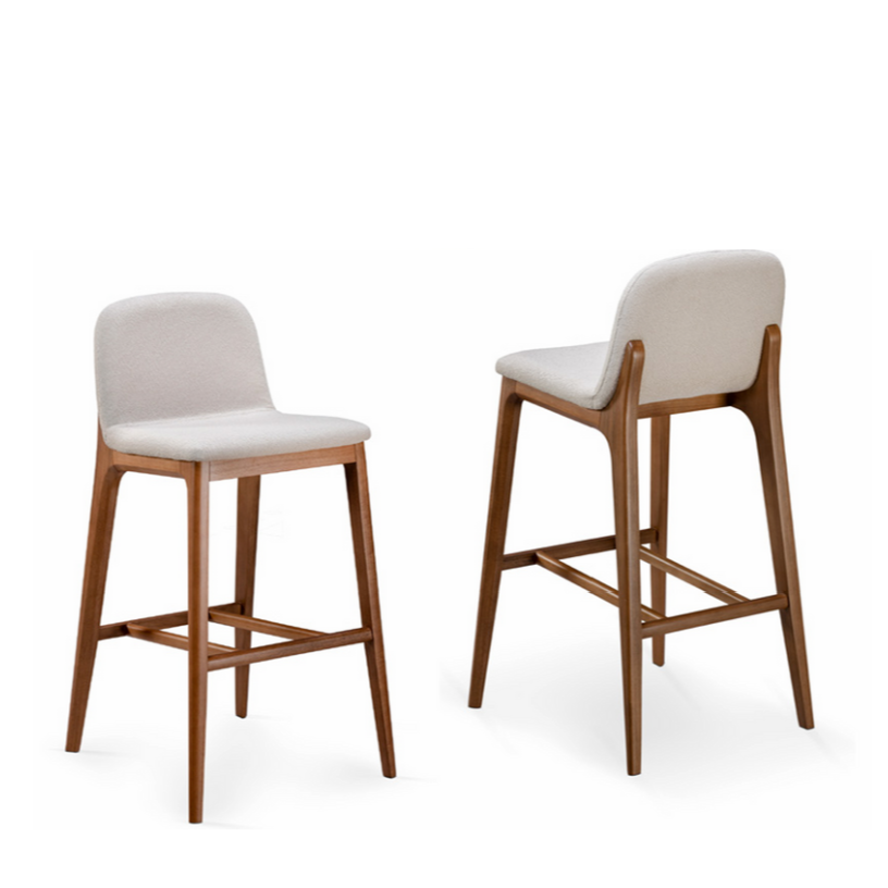 Two bar stools with wooden legs and white cushioned seats on a white background