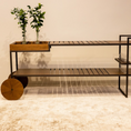 Load image into Gallery viewer, Modern furniture piece with wooden top and metal frame on a neutral background
