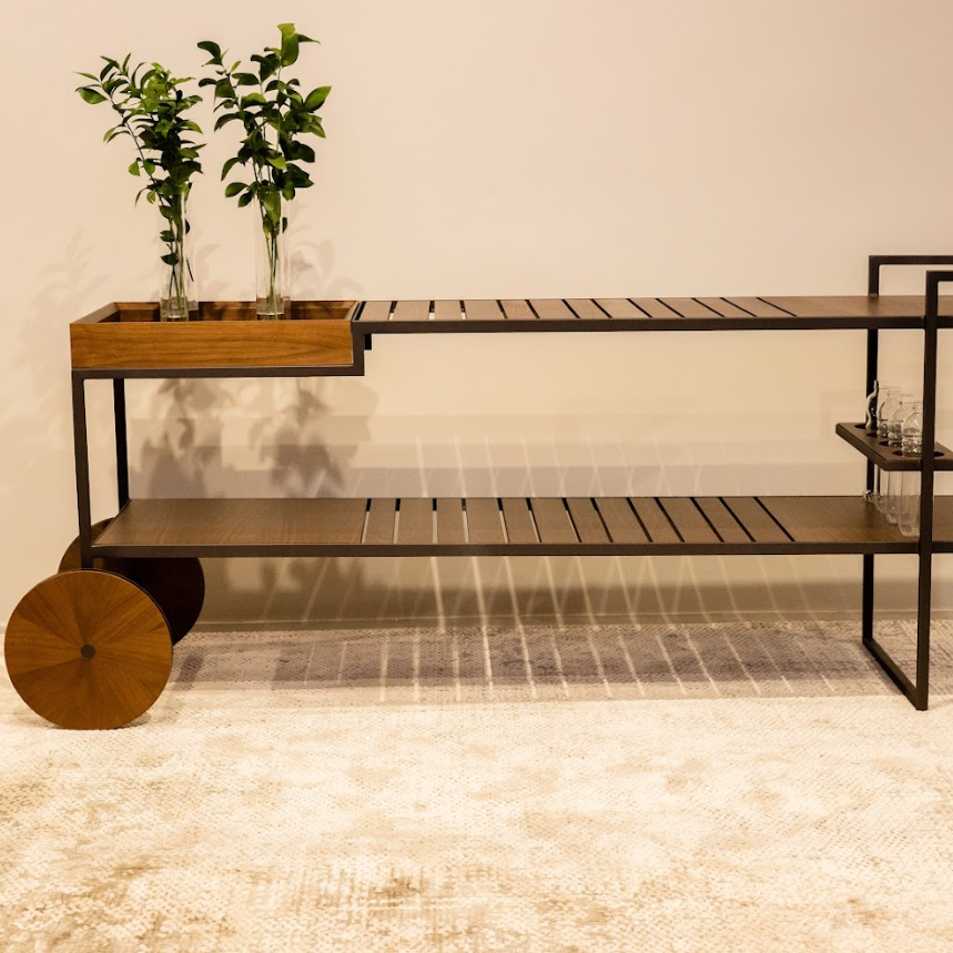 Modern furniture piece with wooden top and metal frame on a neutral background