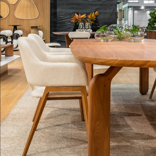 Wooden dining table with chairs in a modern indoor setting