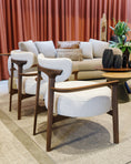 Load image into Gallery viewer, Modern living room with a sofa, chairs, and a coffee table.
