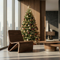 Load image into Gallery viewer, Modern living room with a decorated Christmas tree by large windows with cityscape view.
