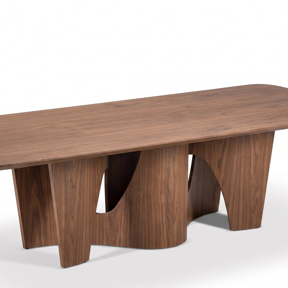A modern rectangular wooden dining table with a rich walnut finish, featuring sculptural curved legs, shown on a clean white background.
