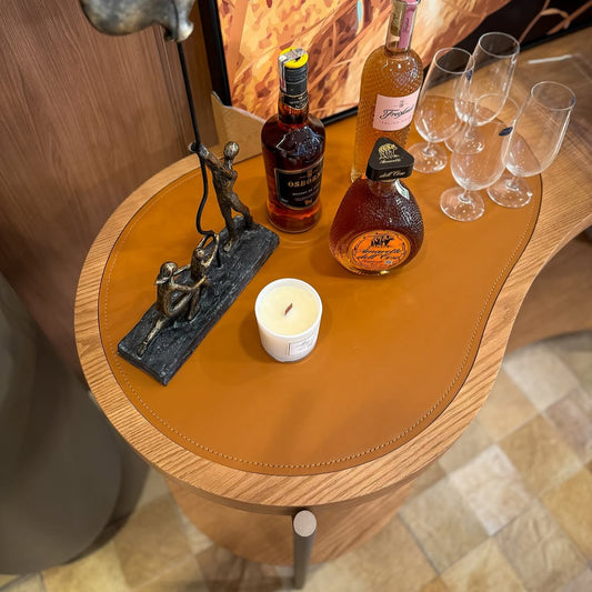 A modern metal and wood console table with an organic, curved design, inspired by Brazilian natural elements.