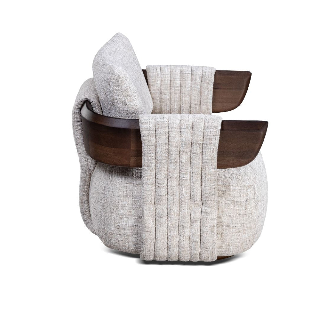 Textured armchair with wooden handles on a white background