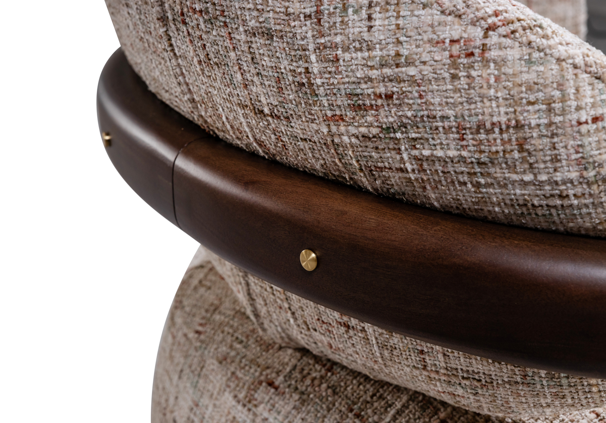 Close-up of a textured chair with wooden armrest and beige cushion on a white background