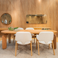 Load image into Gallery viewer, Dining room with wooden table and chairs in a wood-paneled room
