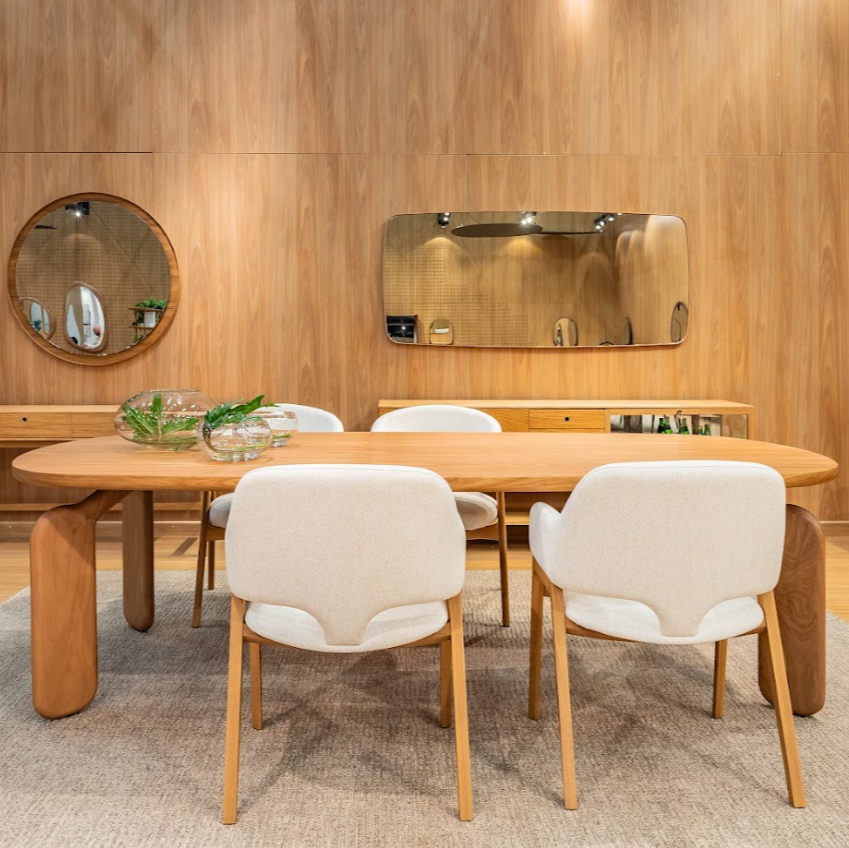 Dining room with wooden table and chairs in a wood-paneled room