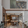 Charger l'image dans la visionneuse de la galerie, Modern living room with a coffee table, sofa, and wall art.

