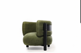 Charger l'image dans la visionneuse de la galerie, An olive green upholstered accent chair with a black cylindrical side table integrated into the backrest, set against a plain white background.
