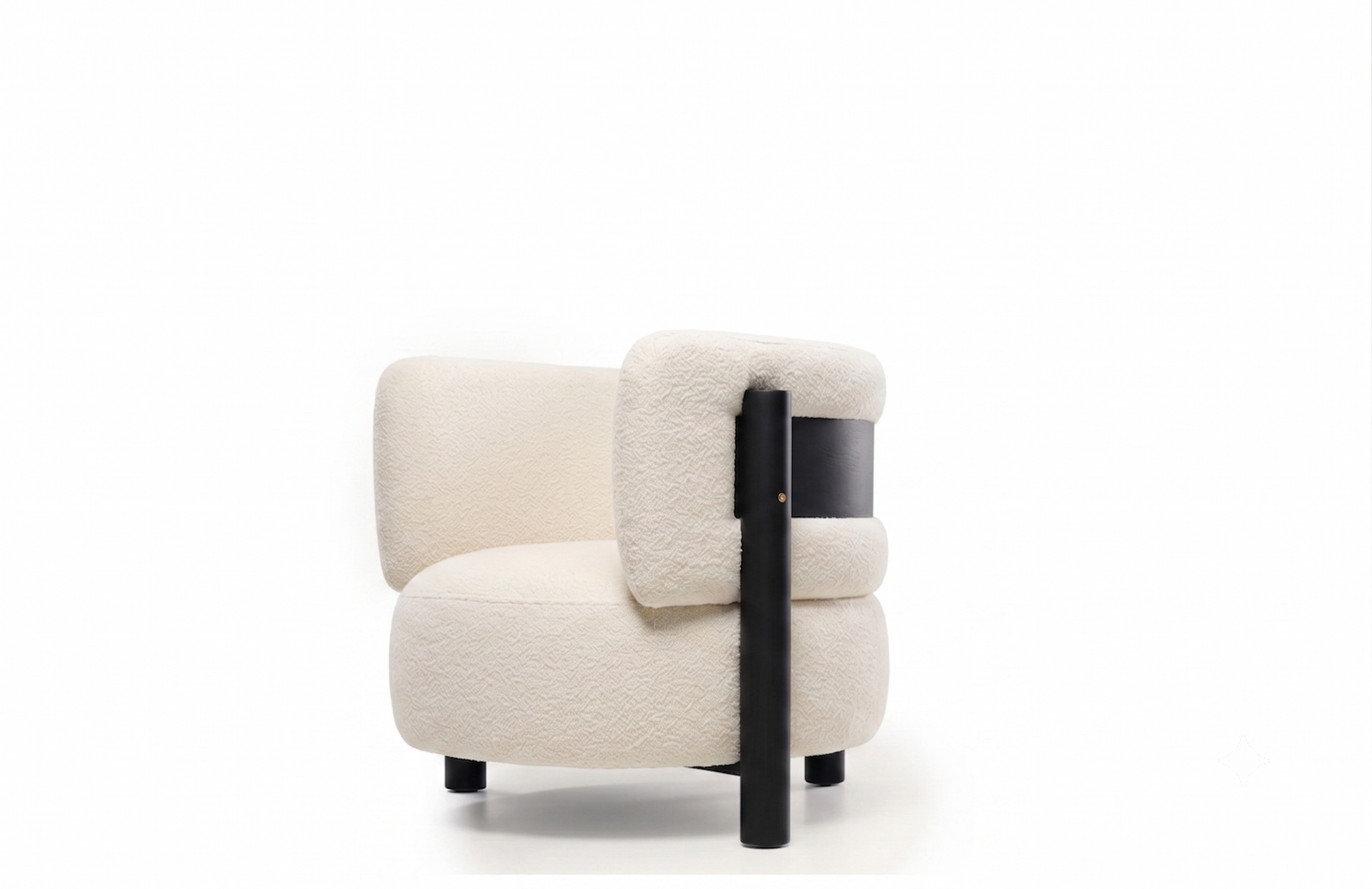 A modern low-profile armchair upholstered in cream bouclé fabric with a black side panel and black legs, shown against a plain white background.